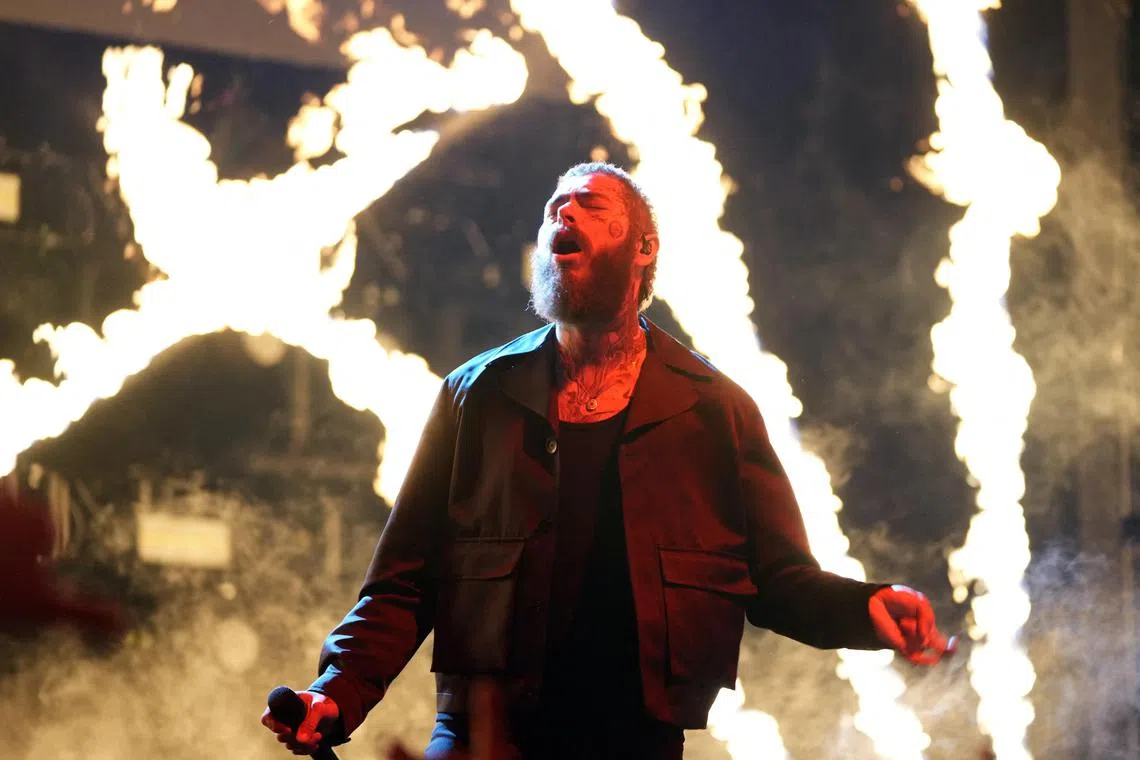 Feb 19, 2023; Salt Lake City, UT, USA; Recording artist Post Malone performs before the 2023 NBA All-Star Game at Vivint Arena. Mandatory Credit: Kyle Terada-USA TODAY Sports