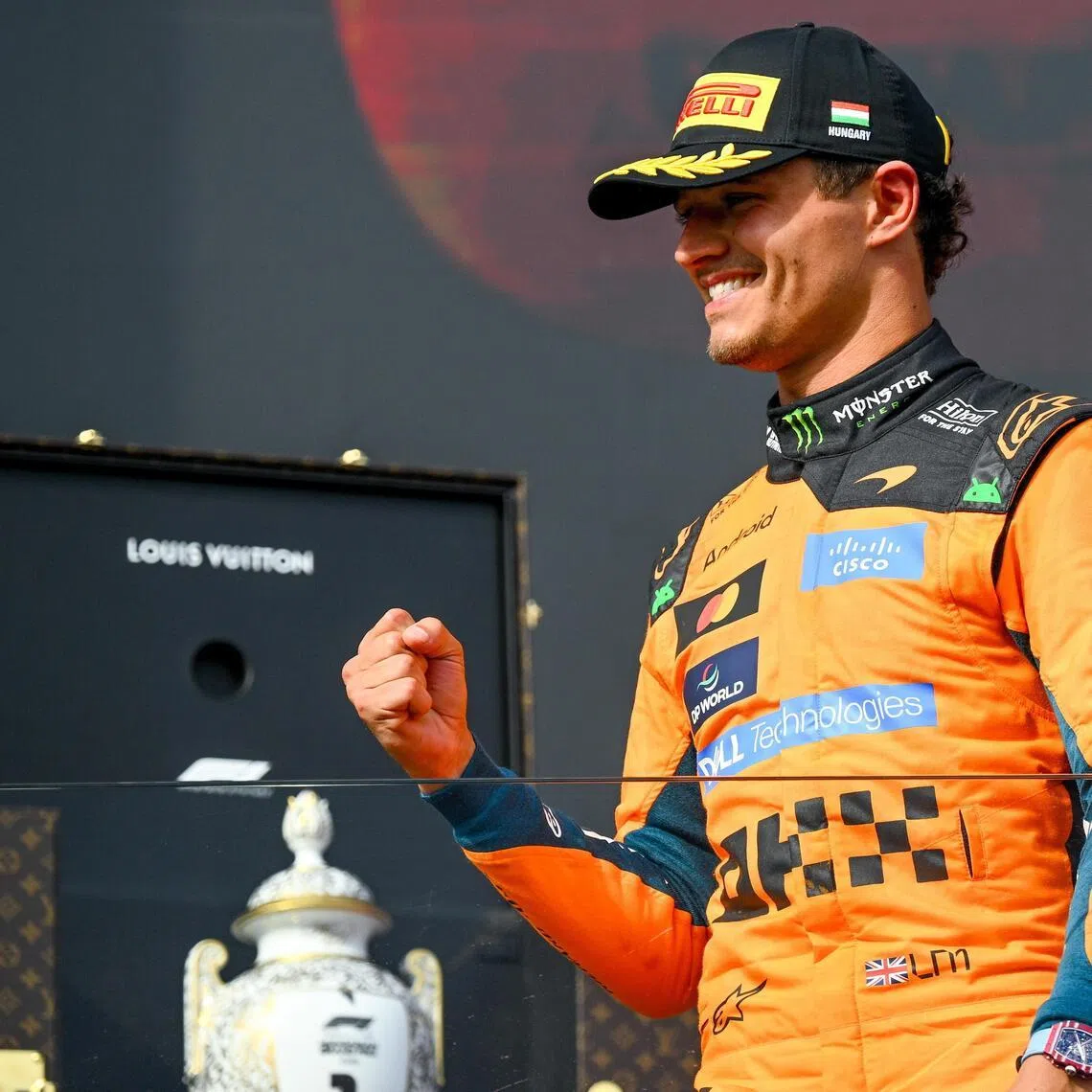 McLaren driver Lando Norris of Britain celebrates his win on the podium after the Formula One Hungarian Grand Prix on July 26.