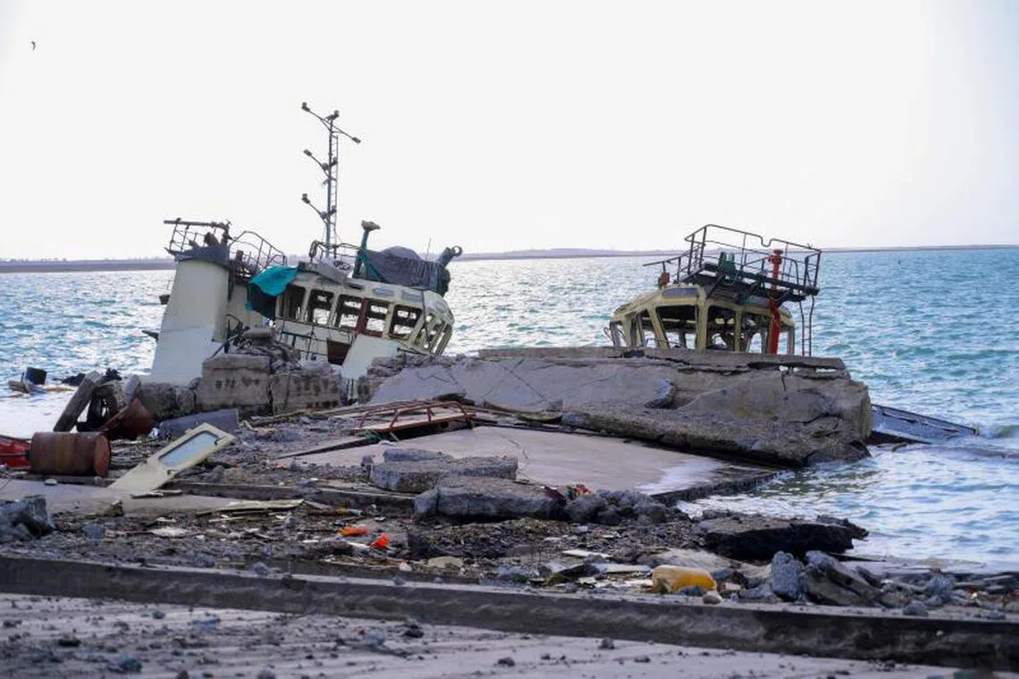 This picture shows destruction at the port in Yemen's city of Hodeida after Israel's military warplanes struck Yemen's rebel-held positions, on May 6, 2025. Israel's military said its warplanes struck Yemen's rebel-held capital Sanaa on May 6, "fully disabling the airport", the latest retaliation for a missile attack by the Iran-backed Huthis on Israel's main airport. (Photo by AFP) / == RESTRICTED TO EDITORIAL USE - MANDATORY CREDIT "AFP PHOTO / HO / SABA" - NO MARKETING NO ADVERTISING CAMPAIGNS - DISTRIBUTED AS A SERVICE TO CLIENTS ==