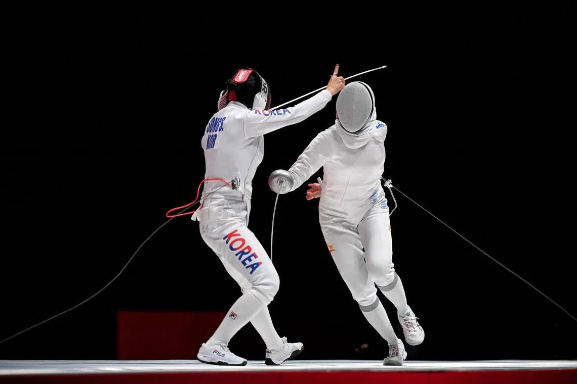 Kiria Tikanah of Singapore (right) in action against Song Se-ra of South Korea during the Women’s Epee Individual final at the Aichi Sky Expo Hall on Sept 22.