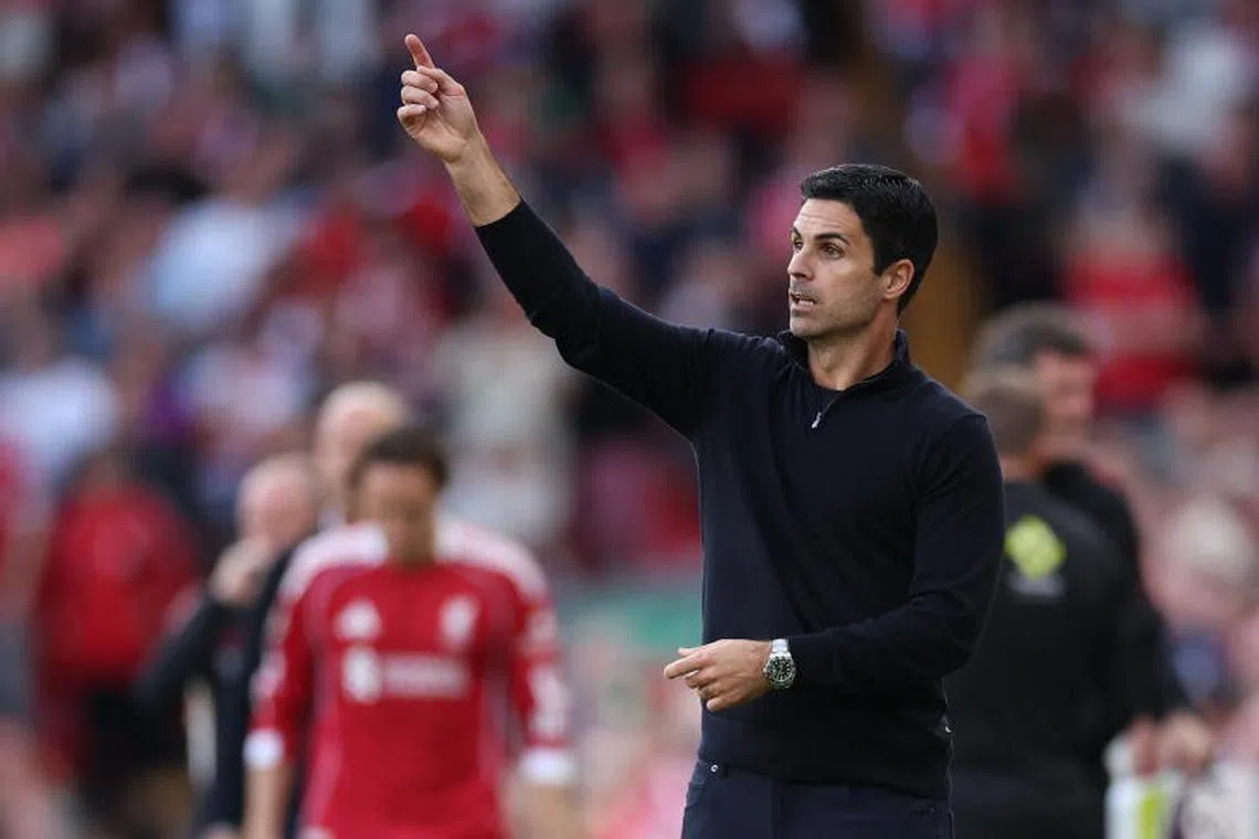 Arsenal manager Mikel Arteta gestures during the English Premier League soccer match between Liverpool and Arsenal.