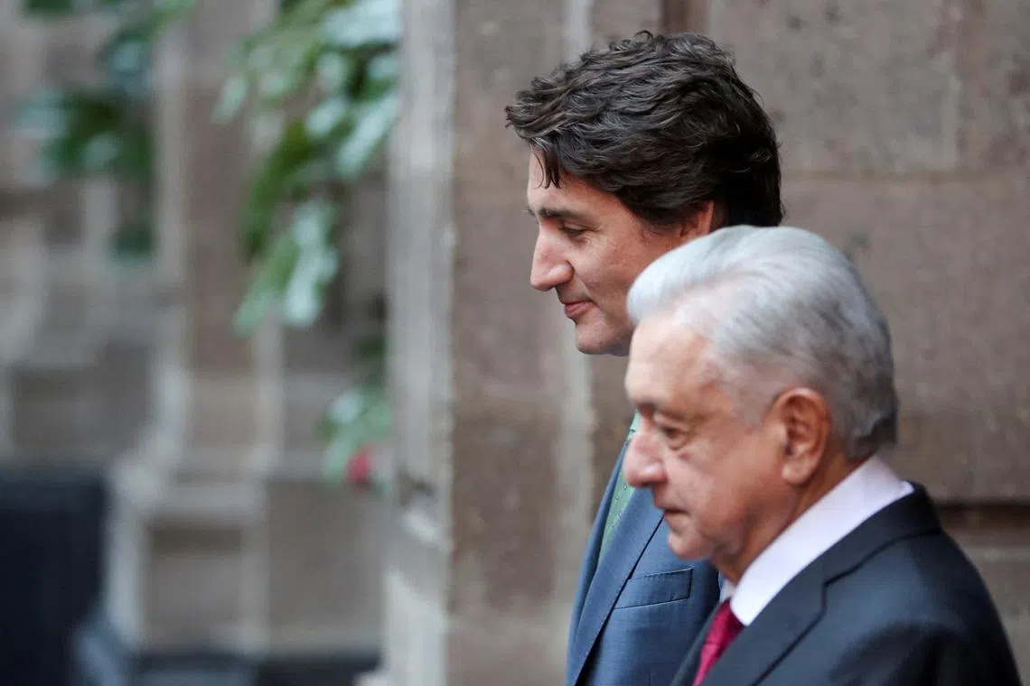 FILE PHOTO: Canada's prime minister, Justin Trudeau, and Mexican President Andres Manuel Lopez Obrador attend an official welcoming ceremony during the North American Leader's Summit at National Palace in Mexico City, Mexico January 11, 2023. REUTERS/Raquel Cunha/File Photo