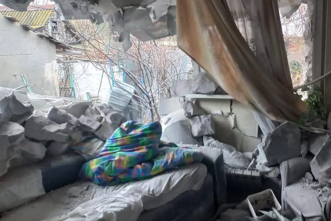 Regional governor Sergiy Lysak posted images of a destroyed apartment where a wall and ceiling had collapsed onto on sofa.