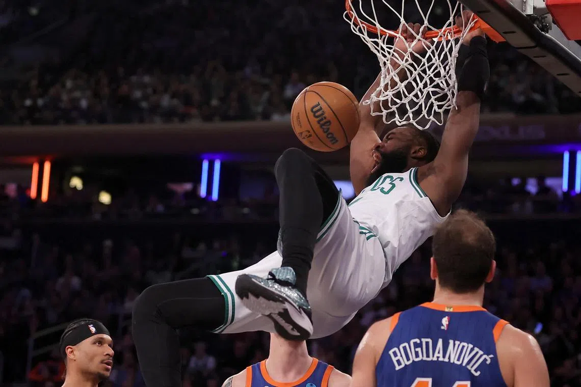 Boston Celtics guard Jaylen Brown dunking during the second quarter against the New York Knicks.