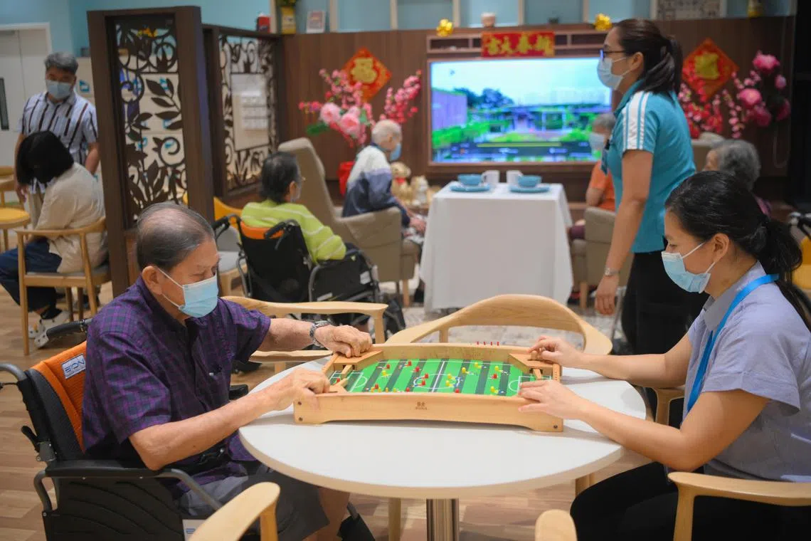Seniors play games at the NTUC Health Nursing Home at Jurong Spring on January 27, 2023.