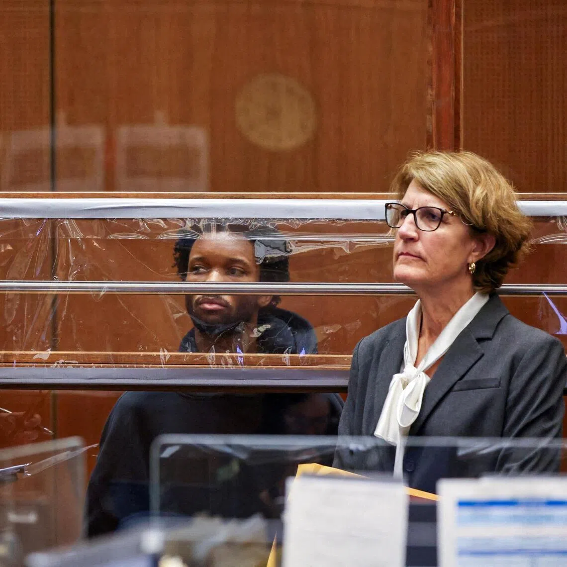 Singer D4vd (centre) - real name David Burke -  during his arraignment for the murder of Celeste Rivas Hernandez in Los Angeles, on April 20.