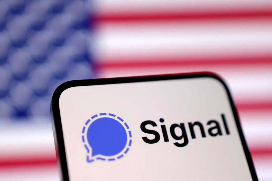 Signal app logo and U.S. flag are seen in this illustration taken March 26, 2025. REUTERS/Dado Ruvic/Illustration