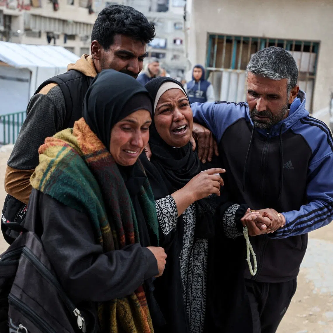 Mourners react during the funeral of two Palestinians killed by an Israeli strike on Thursday, according to medics, at Shifa hospital in Gaza City, February 26, 2026. REUTERS/Dawoud Abu Alkas