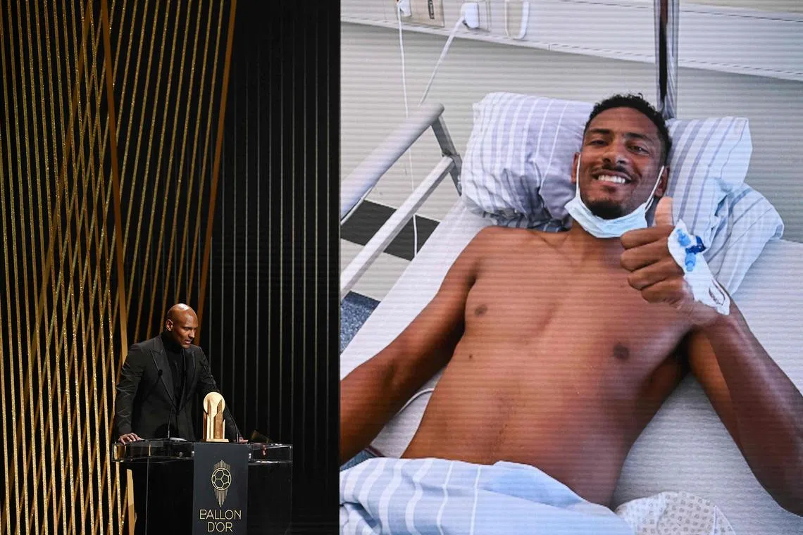 Dortmund's Ivorian forward Sebastien Haller speaks before giving the Yashin Trophy for best goalkeeper during the 2022 Ballon d'Or France Football award ceremony at the Theatre du Chatelet in Paris on Oct 17, 2022. 