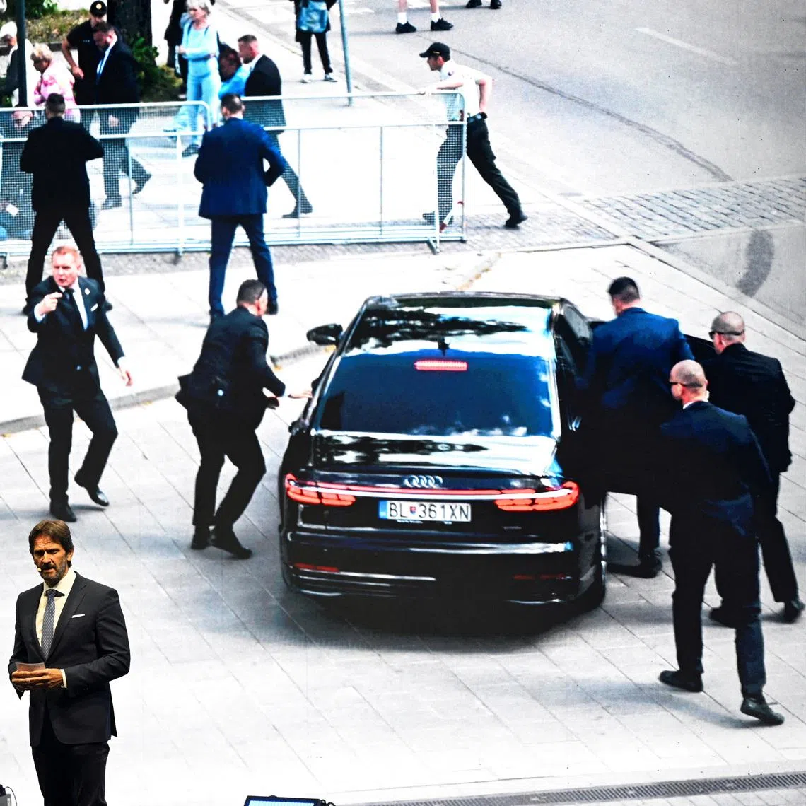 FILE PHOTO: Slovak Defence Minister Robert Kalinak speaks in front of a screen displaying an image from the attempted assassination of Slovakia's Prime Minister Robert Fico, during a SMER-SSD party's rally, in Handlova, central Slovakia May 15, 2025. REUTERS/Radovan Stoklasa/File Photo