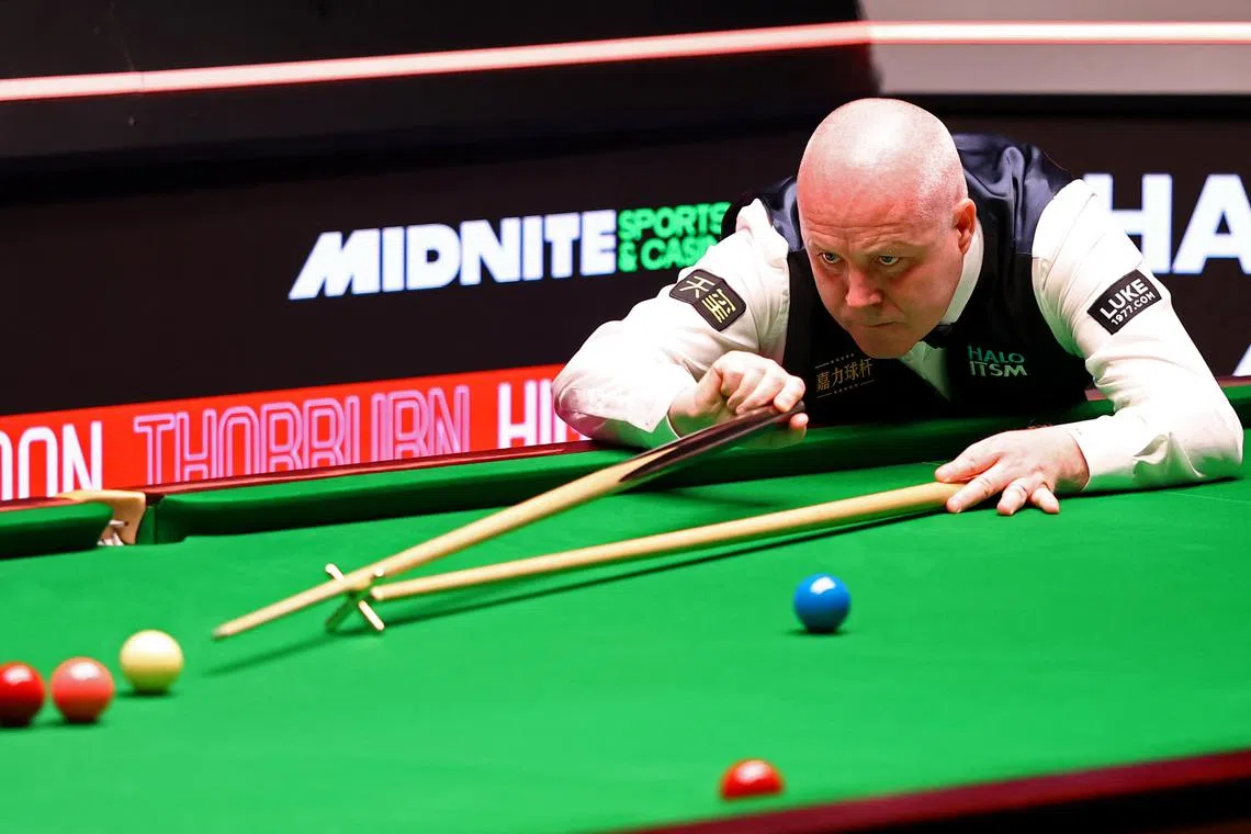 FILE PHOTO: Snooker - World Snooker Championship - The Crucible Theatre, Sheffield, Britain - April 30, 2025 Scotland's John Higgins in action during his quarterfinal match against Wales' Mark Williams Action Images via Reuters/Andrew Boyers/File Photo