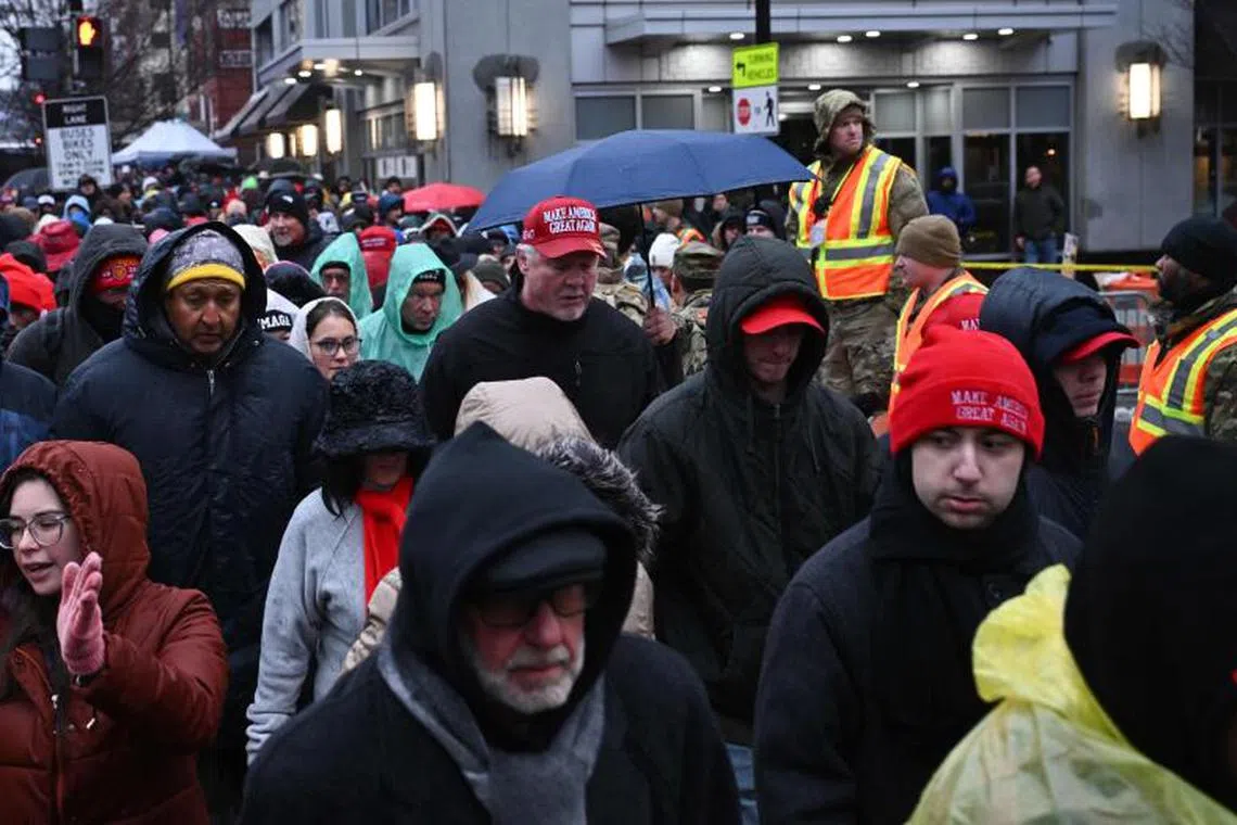 Supporters of US President-elect Donald Trump wait outside for a MAGA victory rally at Capital One Arena in Washington, DC, on Jan 19, 2025, one day ahead of Trump‘s inauguration. (Photo by ANGELA WEISS / AFP)
