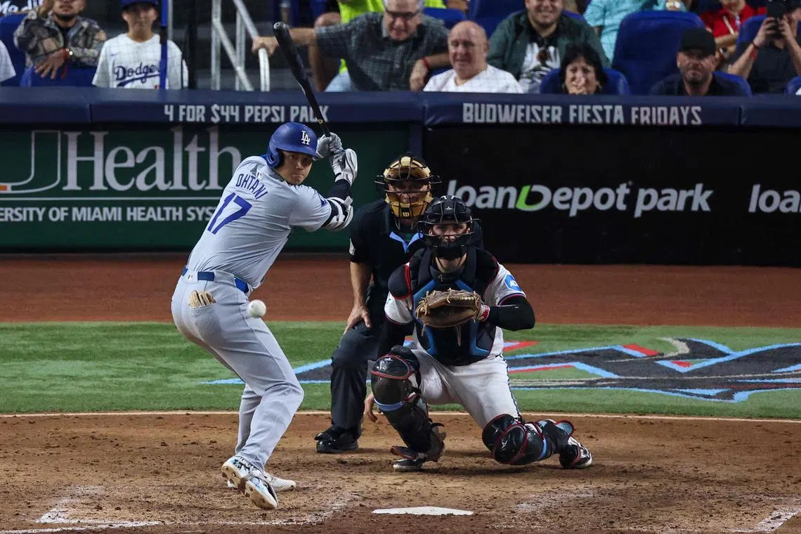 Shohei Ohtani of the Los Angeles Dodgers batting in the seventh inning during the game against Miami Marlins at loanDepot park on Sept 19, 2024. He is the first player in MLB history to reach 50 home runs and 50 stolen bases in a single season. 