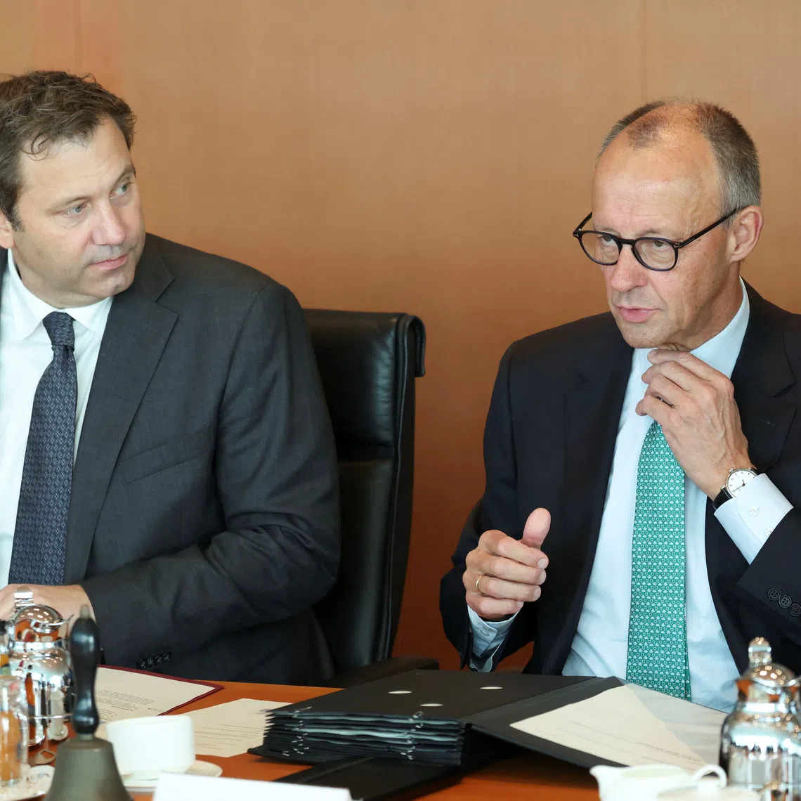 German Chancellor Friedrich Merz and Finance Minister Lars Klingbeil wait for the start of a cabinet meeting at the Chancellery in Berlin, Germany, October 14, 2026. REUTERS/Leonhard Foeger