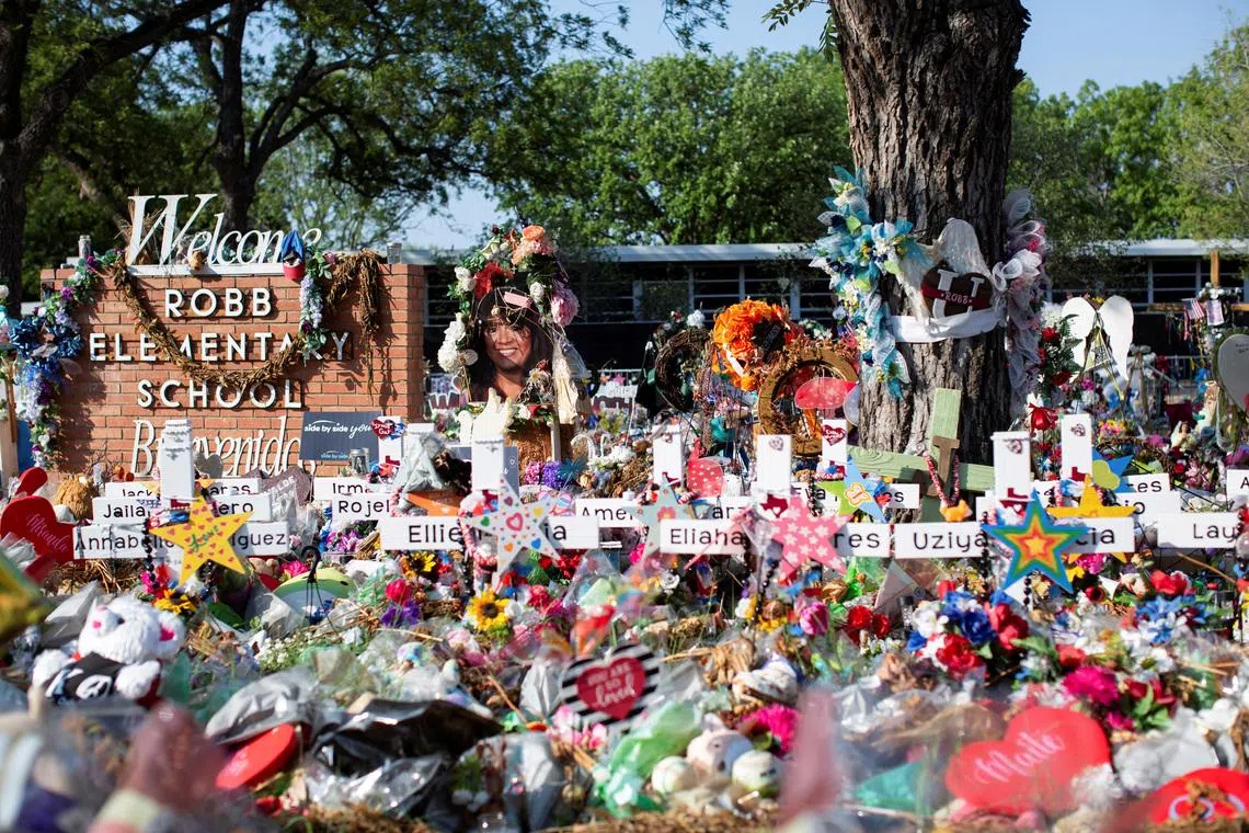 A memorial set up outside Robb Elementary School in Uvalde, Texas, in July 2022, after a shooting that killed 19 elementary pupils and two teachers.  