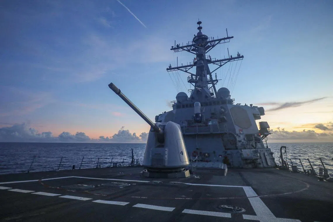FILE PHOTO: Arleigh Burke-class guided-missile destroyer USS Benfold (DDG 65), forward-deployed to the U.S. 7th Fleet area of operations, conducts underway operations in the South China Sea, in this handout picture released on July 13, 2022. U.S. Navy/Handout via REUTERS ATTENTION EDITORS - THIS IMAGE WAS PROVIDED BY A THIRD PARTY/File Photo