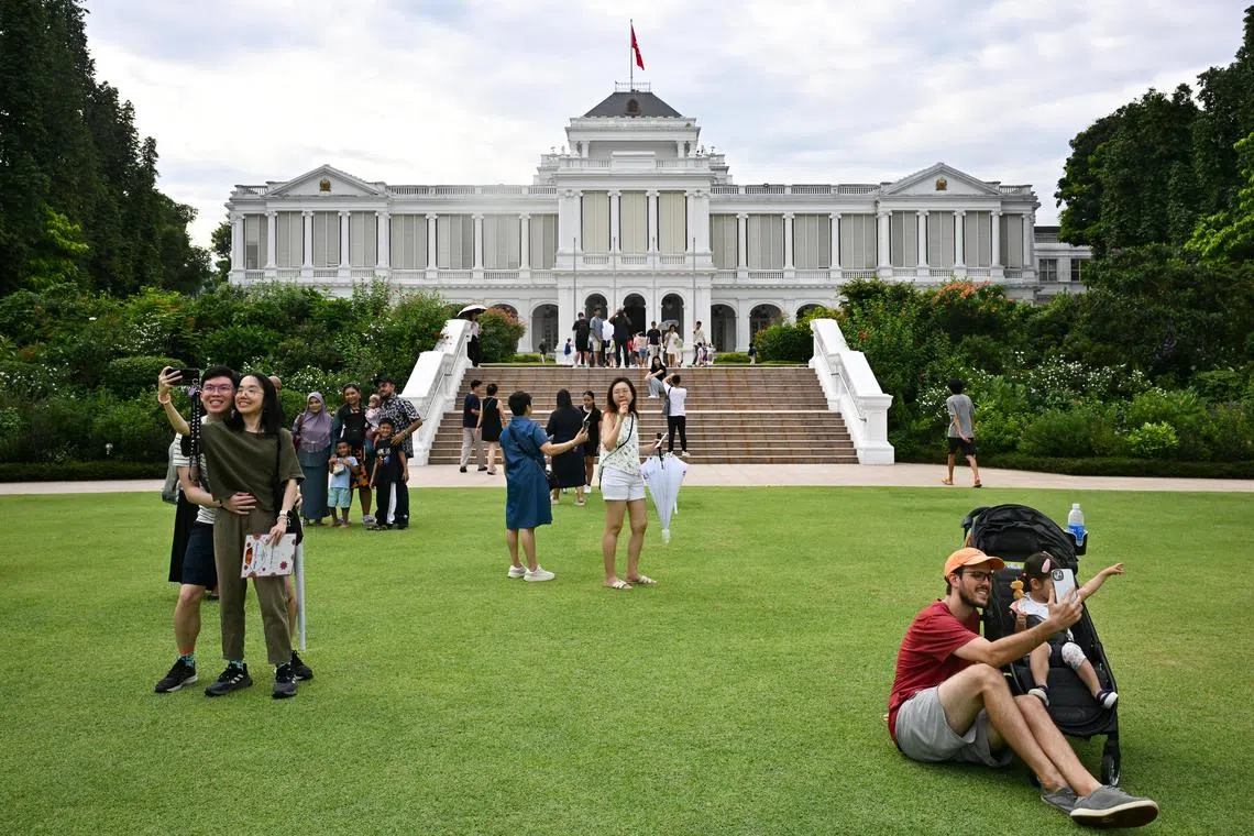 ST20241020-202496800103-Lim Yaohui-Joyce Teo-jtistana20/
Visitors taking photographs with the Main Building during Deepavali Istana Open House on Oct 20, 2024.
Members of the public can enjoy a series of live performances and activity booths, participate in a scavenger hunt, and tour the Istana grounds.
(ST PHOTO: LIM YAOHUI)