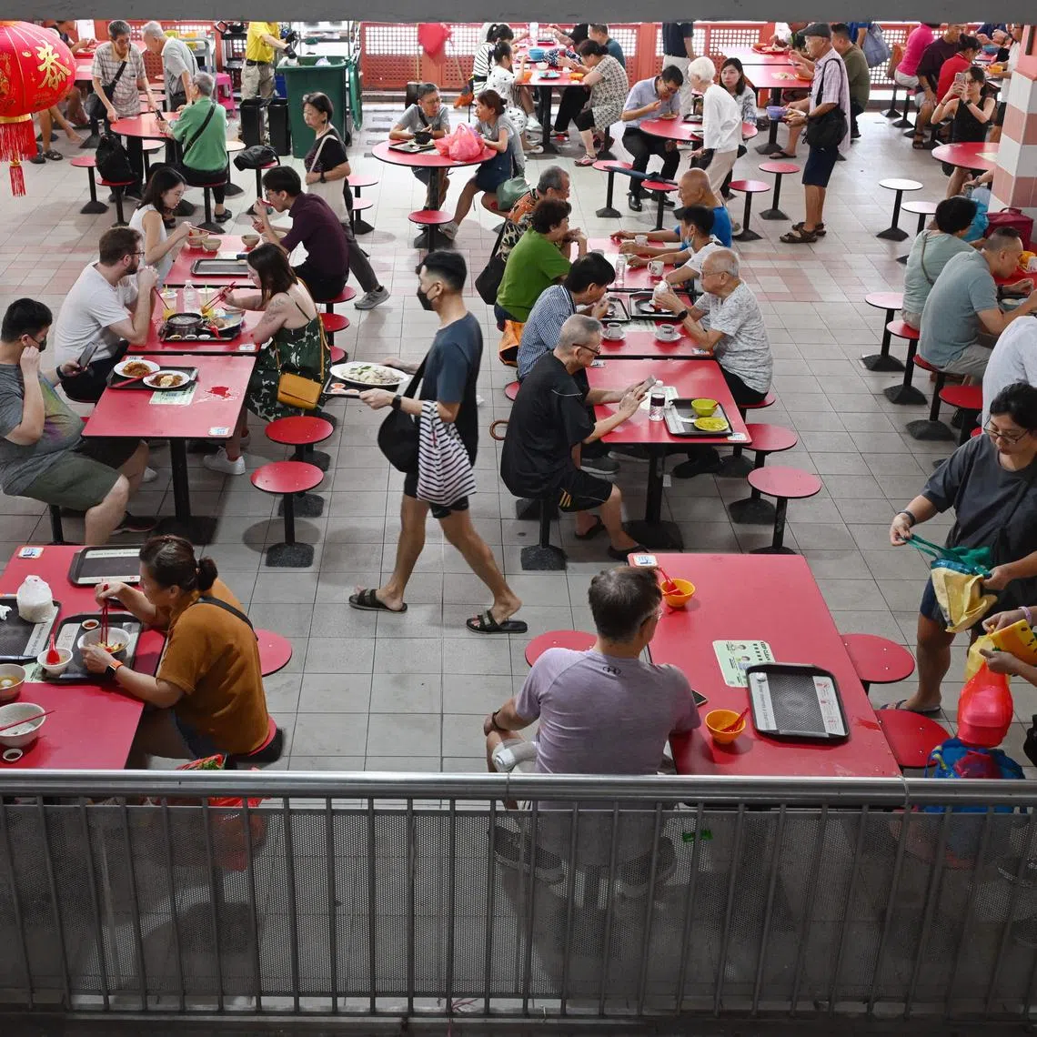 While tables in hawker centres and food courts are cleaned regularly, they are not sanitised to the same standard as plates or food preparation surfaces.