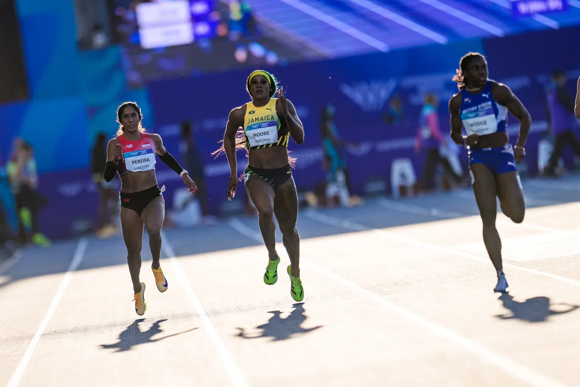 Veronica Shanti Pereira on her way to finishing third behind Jamaica’s Ashanti Moore and winner Adaejah Hodge from the British Virgin Islands (right) in the second semi-final of the Commonwealth Games women’s 200m event on July 30.