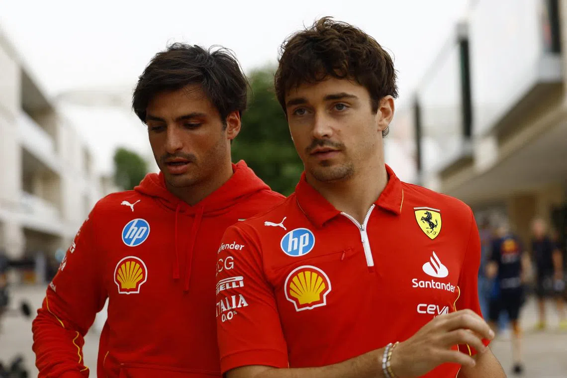 Ferrari's Carlos Sainz Jr (left) and Charles Leclerc arriving at the Lusail circuit on Nov 28, ahead of the Qatar grand prix.