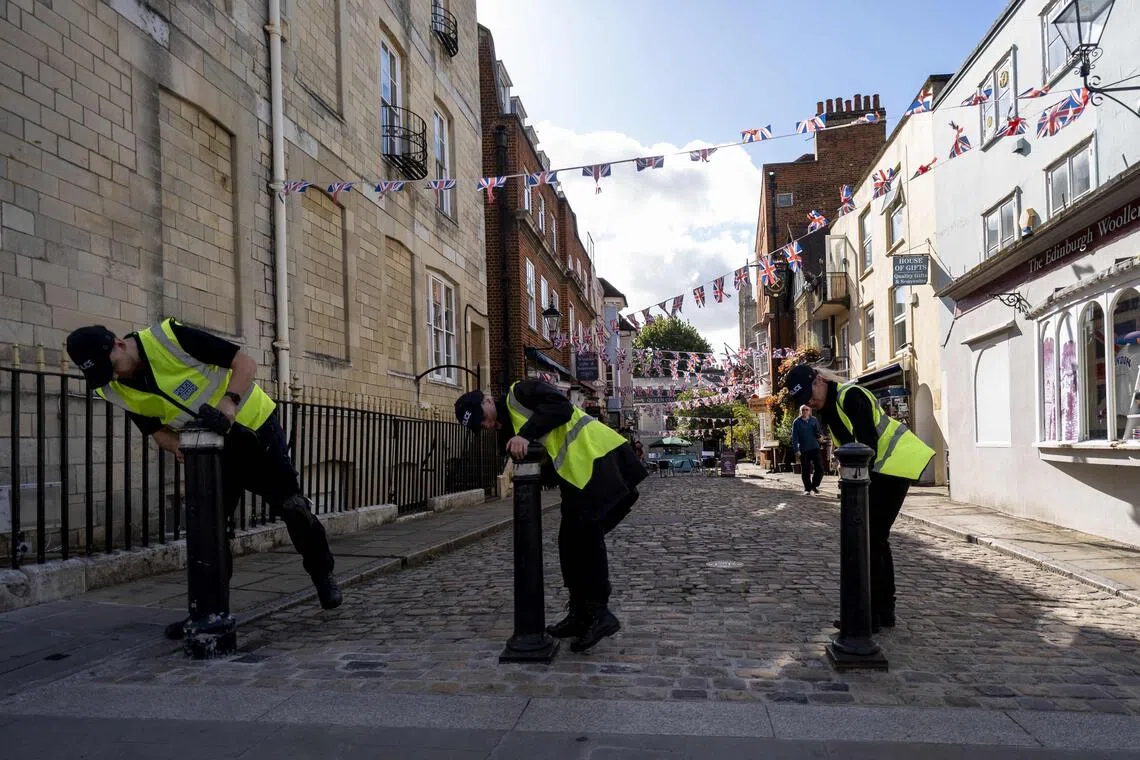 Police officers carry out security searches outside of Windsor Castle ahead of US President Donald Trump’s state visit.