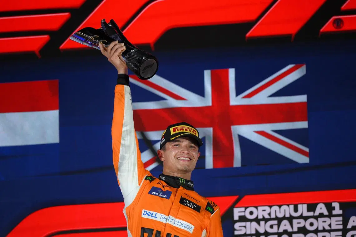 British driver Lando Norris of McLaren F1 Team celebrates after winning the Formula One Singapore Airlines Singapore Grand Prix at the Marina Bay street circuit on Sept 22, 2024.