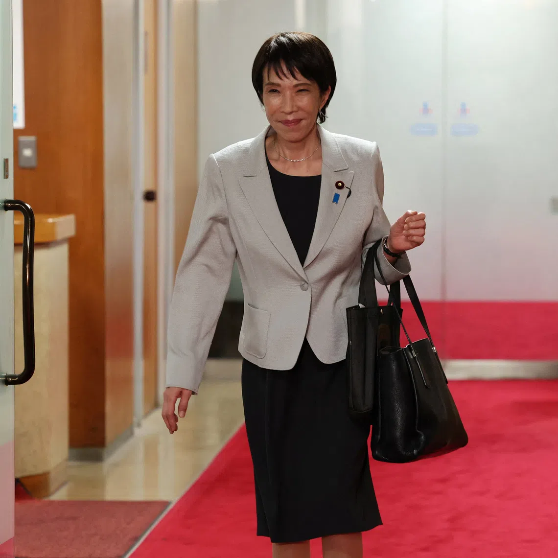 Leader of Japan's ruling Liberal Democratic Party (LDP) Sanae Takaichi leaves after a meeting with party members at its headquarters in Tokyo, Japan, October 16, 2025. REUTERS/Kim Kyung-Hoon