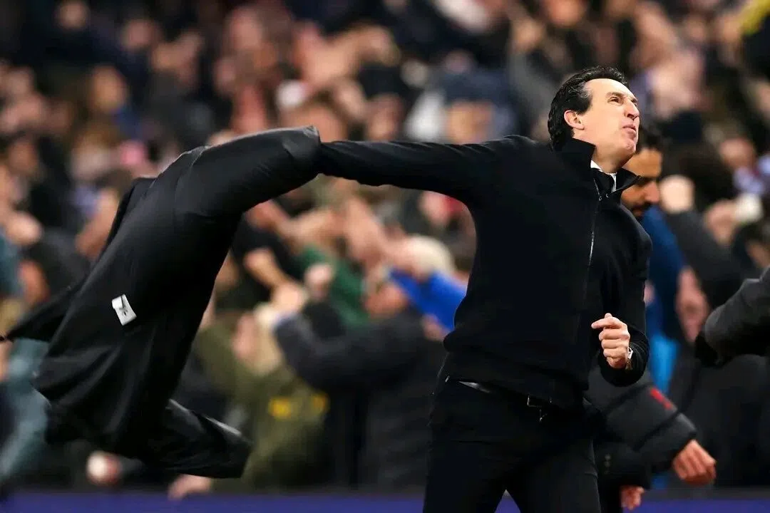 A thrilled Unai Emery throws his jacket into the air after Morgan Rogers scores his second of the afternoon to clinch a pulsating 2-1 win at Villa Park on Dec 21.