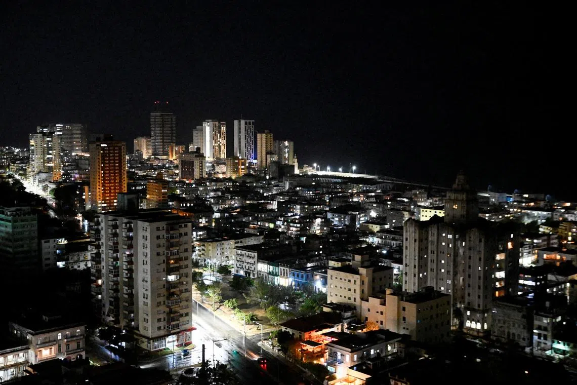 Buildings and street lights illuminate the night as Cubans this week began to reap the benefits of a recent 100,000 metric ton delivery of Russian oil, a temporary lifeline for the energy-starved nation and the first major shipment of oil to the island since the United States moved to cut off its fuel early this year, in Havana, Cuba, April 23, 2026. REUTERS/Norlys Perez