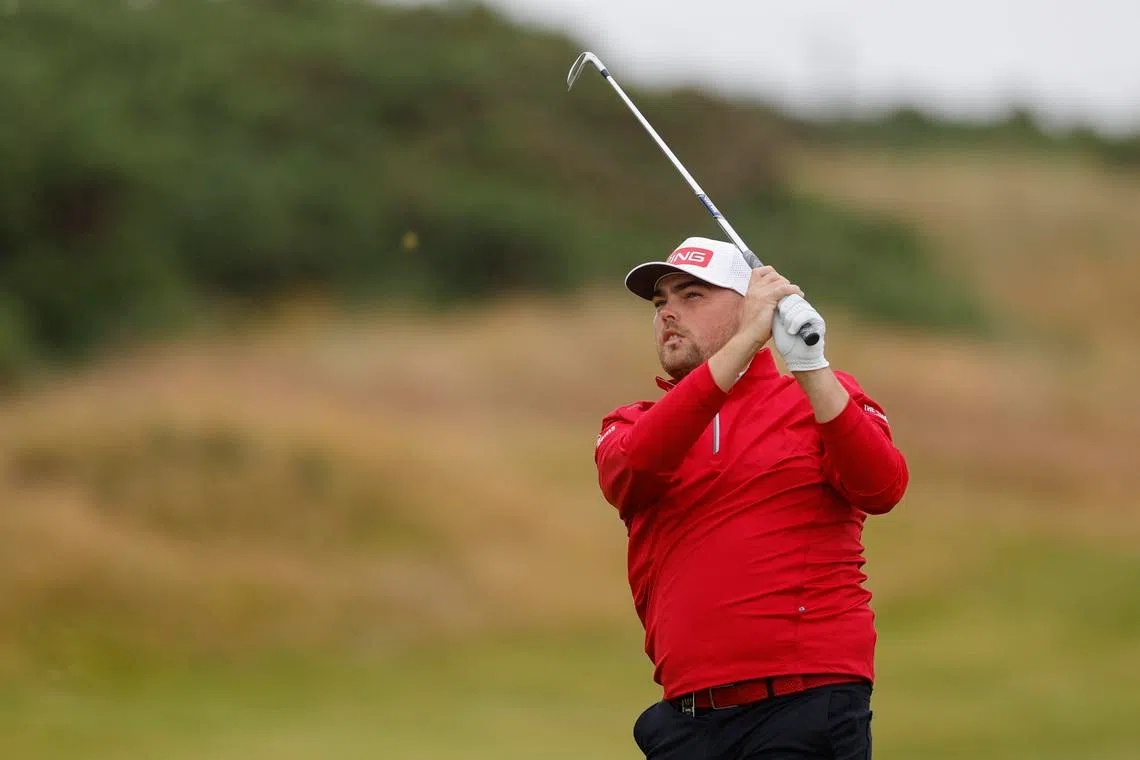 Golf - The 152nd Open Championship - Royal Troon Golf Club, Troon, Scotland, Britain - July 18, 2024 England's Dan Bradbury hits his approach on the 11th fairway during the first round REUTERS/Andrew Couldridge/File Photo