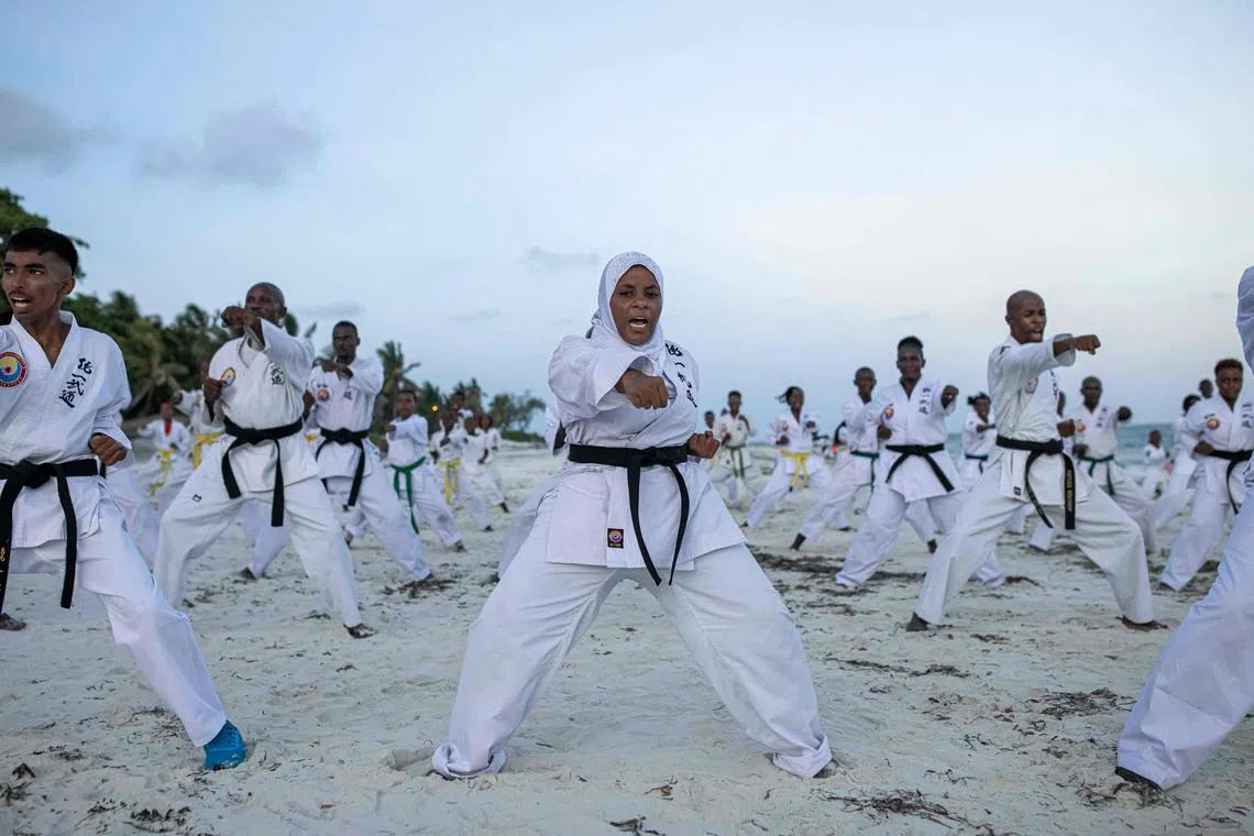 Athletes perform at a beach exhibition ahead of the 10th Mombasa Open Tong-IL Moo-Doo International Martial Arts Championship 2022, in Mombasa, Kenya, on December 15, 2022. The coastal city will be hosting this martial arts championship over the weekend, with athletes representing 28 different countries. 