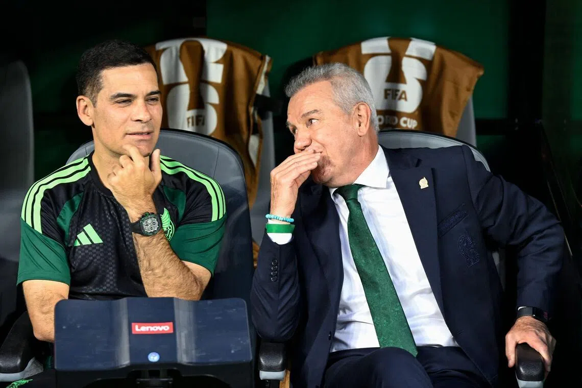 (FILES) Mexico's head coach Javier Aguirre (R) and assistant coach Rafael Marquez (L) talk ahead of the 2026 World Cup Group A football match between the Czech Republic and Mexico at the Mexico City Stadium in Mexico City on June 24, 2026. Mexico officially announced on July 8, 2026 the appointment of former defender Rafael Marquez as the new head coach of the national football team, a change that had been expected following the country’s elimination from the World Cup. ‘Kaiser’ Marquez, aged 47, was part of the coaching staff of the outgoing manager, Javier Aguirre. (Photo by Alfredo ESTRELLA / AFP)