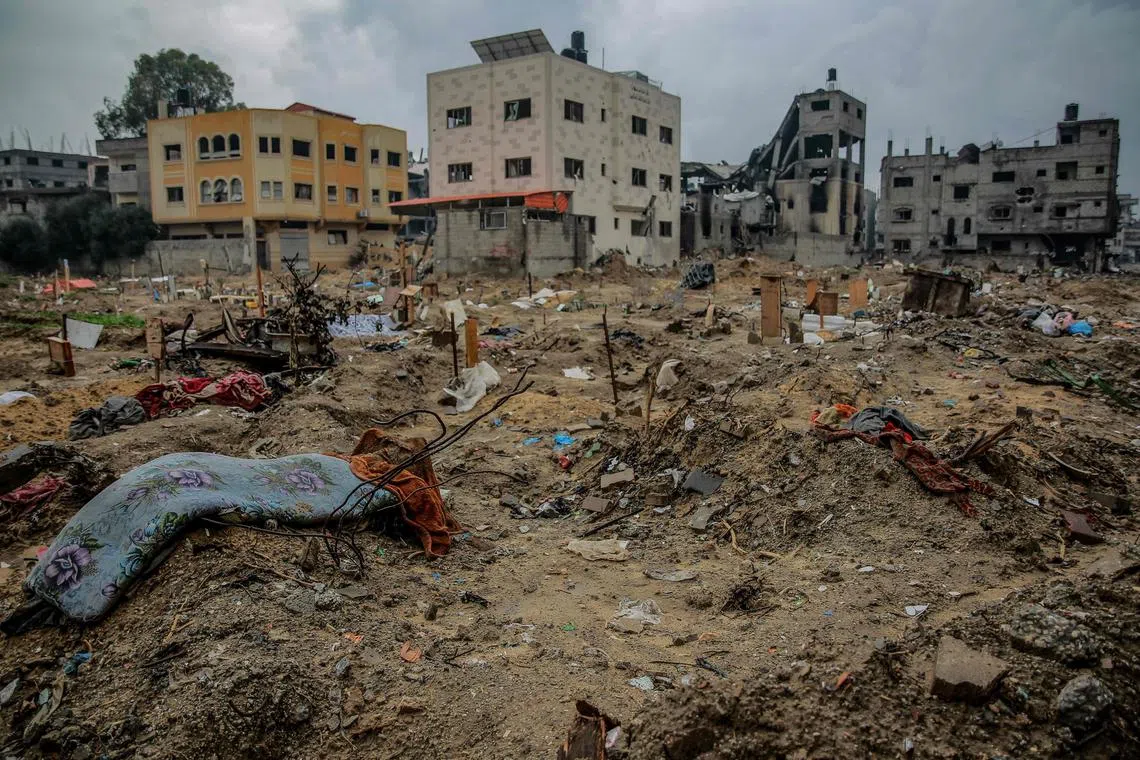 A makeshift cemetery in the eastern al-Tuffah neighbourhood of Gaza City after it was reportedly bulldozed by Israeli forces.  