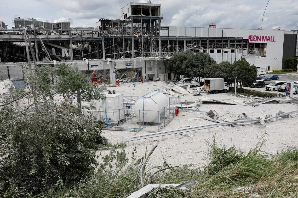 Debris is strewn at the damaged Aeon Mall shopping centre, where an explosion occurred after an earthquake with 7.1 magnitude struck Japan’s southern Kumamoto prefecture on July 29.