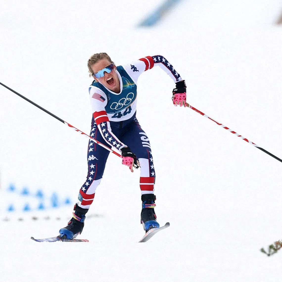 Jessie Diggins of the United States crosses the finish line of the women's cross country 10k interval.  REUTERS/Kai Pfaffenbach