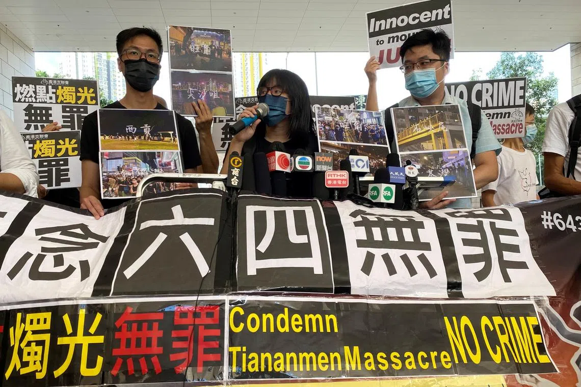 FILE PHOTO: Vice-chairwoman of Hong Kong Alliance in Support of Patriotic Democratic Movements of China, Chow Hang-tung, speaks to the media before facing charges related to an illegal vigil assembly commemorating the 1989 Tiananmen Square crackdown last year, in Hong Kong, China June 11, 2021. REUTERS/Jessie Pang/File Photo