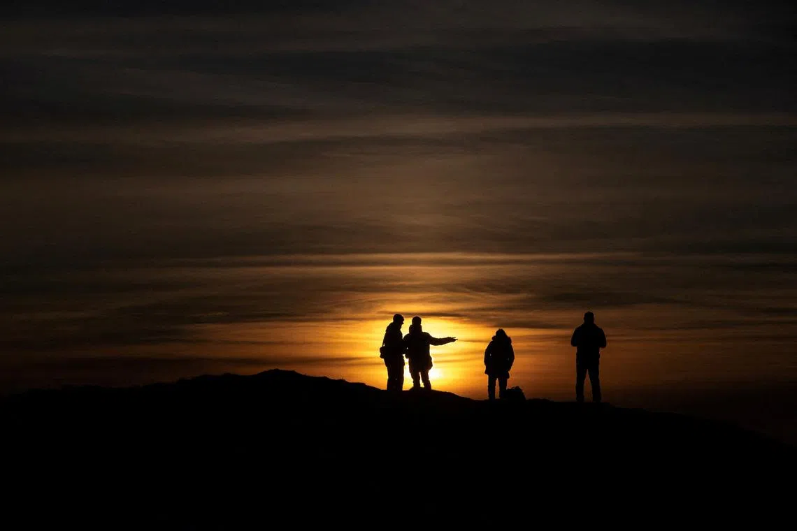People watching the sunset in Nuuk, Greenland, on Jan 25, 2026. 
