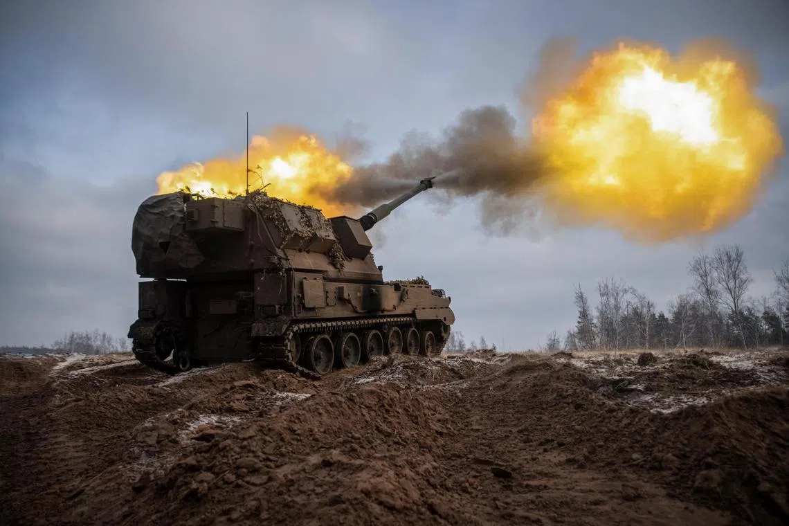 Ukrainian servicemen fire a Krab self-propelled howitzer towards Russian positions, in the Donetsk region of Ukraine, on Jan 17, 2023.