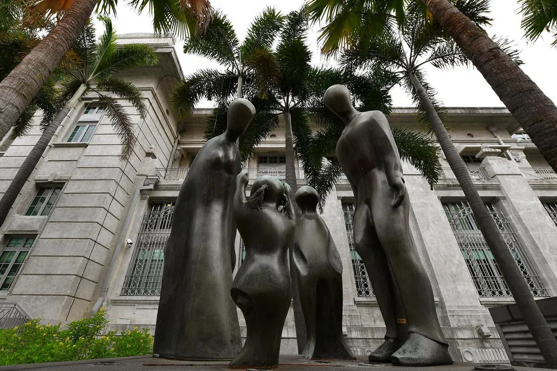 A sculpture titled, Family by Brother Joseph McNally outside the Family Justice court (the former Ministry of Labour).