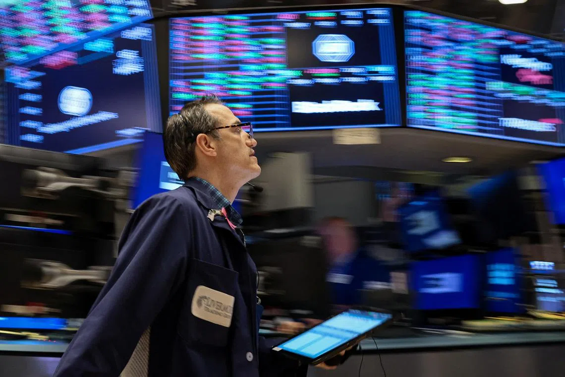 A trader works on the floor of the New York Stock Exchange.