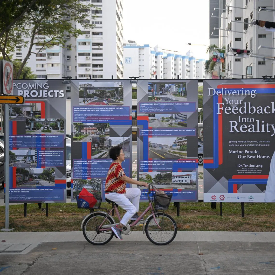 Outdoor boards displaying upcoming projects for Marine Parade GRC next to the face of Marine Parade ward MP Tan See Leng along Marine Parade Central Road on March 8, 2025.