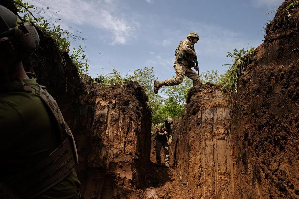 Ukrainian soldiers dig defensive trenches near Kostyantynivka, Ukraine.