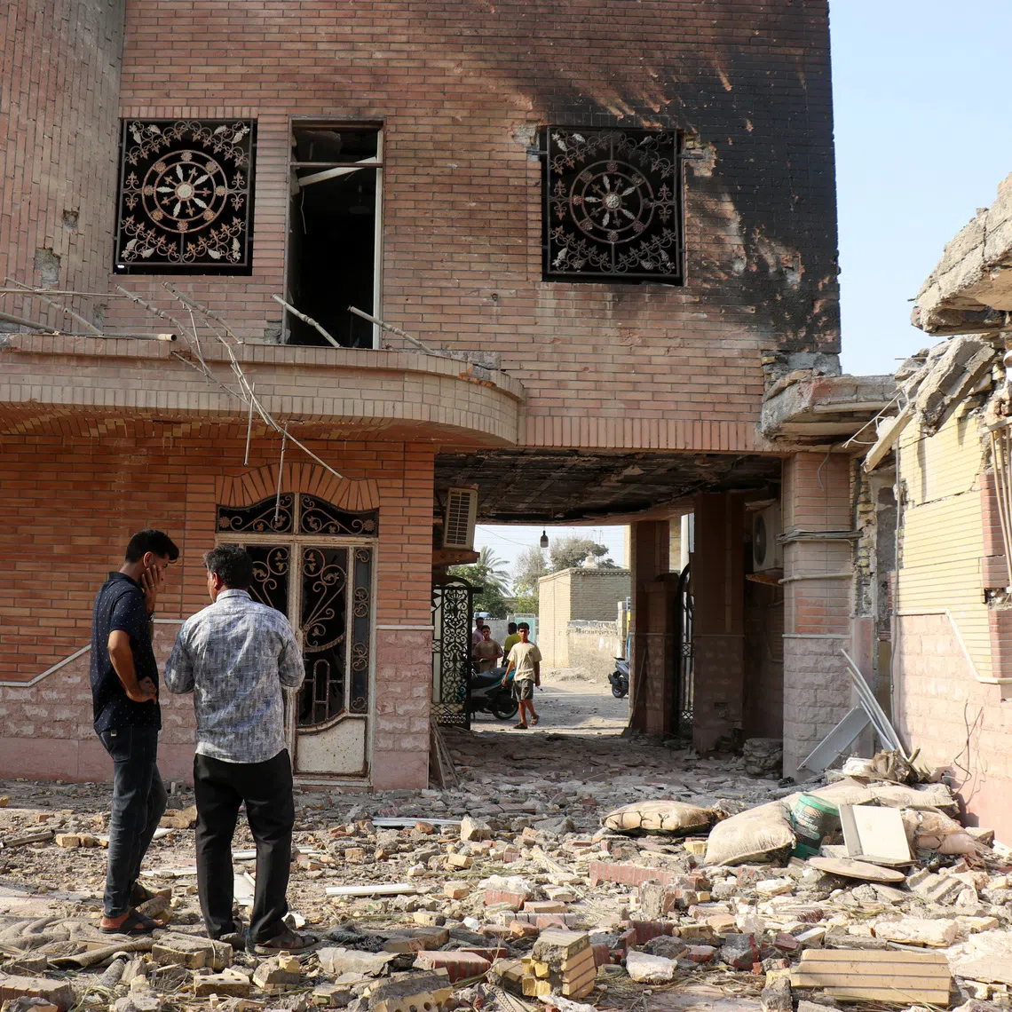Rubble around homes in the village of Kuhestak, in Iran’s Sirik county, after a reported US strike.