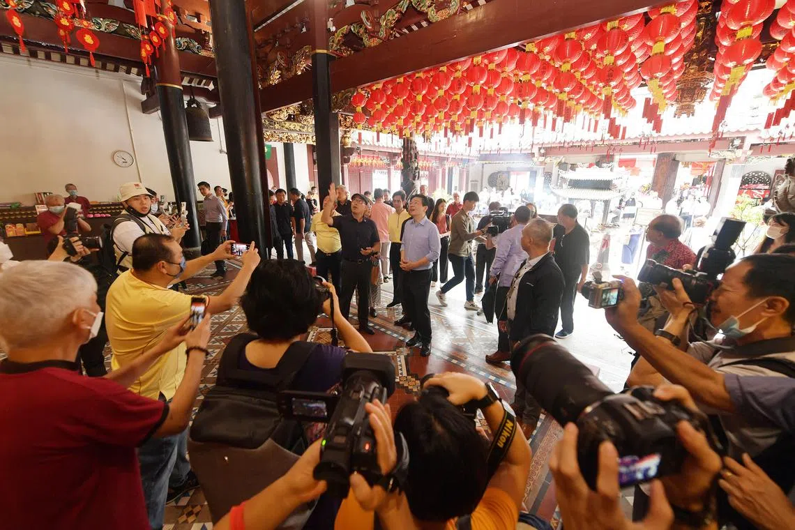 sfhokkien / ST20221202_202269137132 / Alphonsus Chern //

Dr Koh Chin Yee (in black), vice-chairman, cultural committee, SHHK, taking DPM Lawrence Wong (in blue) on a tour of the Thian Hock Keng Temple.

Mr Wong also launched a web app for the temple at the opening ceremony of the 7th Singapore Hokkien Festival on Dec 2.