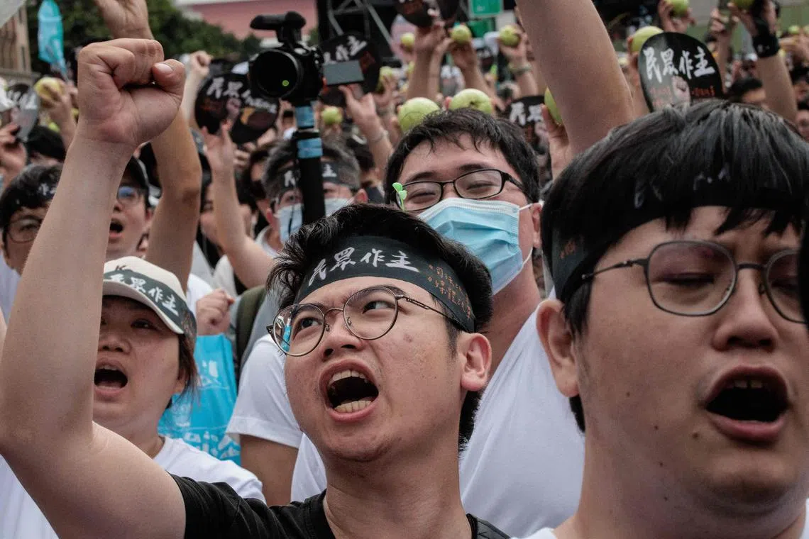 People shout slogans during a protest organised by the Taiwan People's Party (TPP) against Taiwan's ruling Democratic Progressive Party (DPP) ahead of the inauguration ceremony of Taiwan's president-elect Lai Ching-te and vice-president-elect Hsiao Bi-khim, in Taipei on May 19, 2024. (Photo by Yasuyoshi CHIBA / AFP)