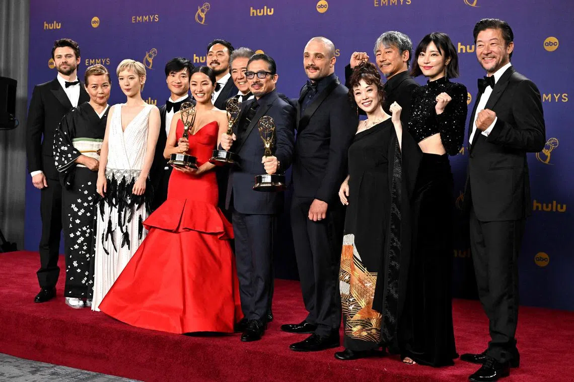 Japanese actor Hiroyuki Sanada (centre), alongside cast and crew, winners of Outstanding Drama Series for Shogun, pose in the press room during the 76th Emmy Awards at the Peacock Theatre at L.A. Live in Los Angeles on Sept 15.