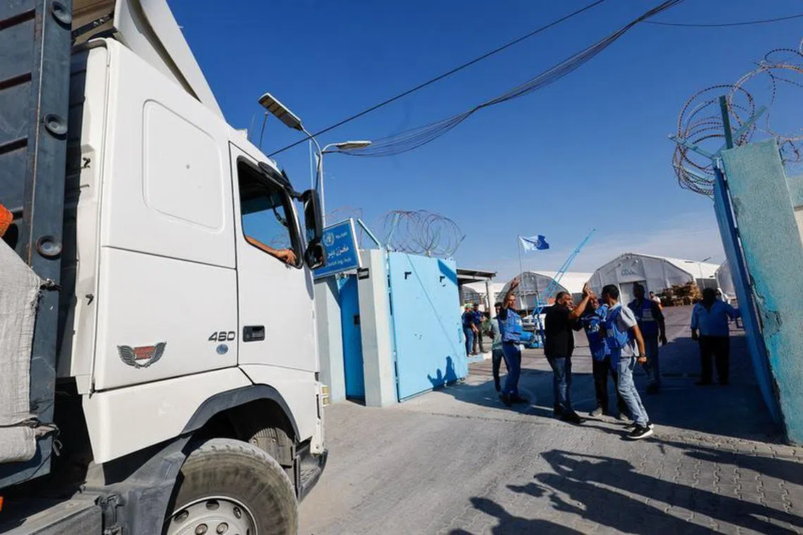 An aid truck arrives at a UN storage facility as the conflict between Israel and Palestinian Islamist group Hamas continues, in the central Gaza Strip October 21, 2023. REUTERS/Mohammed Salem