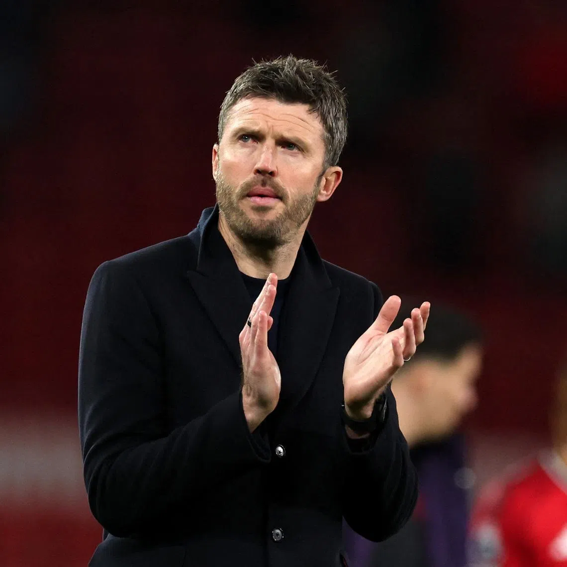 Soccer Football - Premier League - Manchester United v Leeds United - Old Trafford, Manchester, Britain - April 13, 2026 Manchester United manager Michael Carrick applauds fans after the match REUTERS/Phil Noble