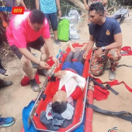 Rescuers brought the Singaporean down on a stretcher, before handing him over to medical personnel.