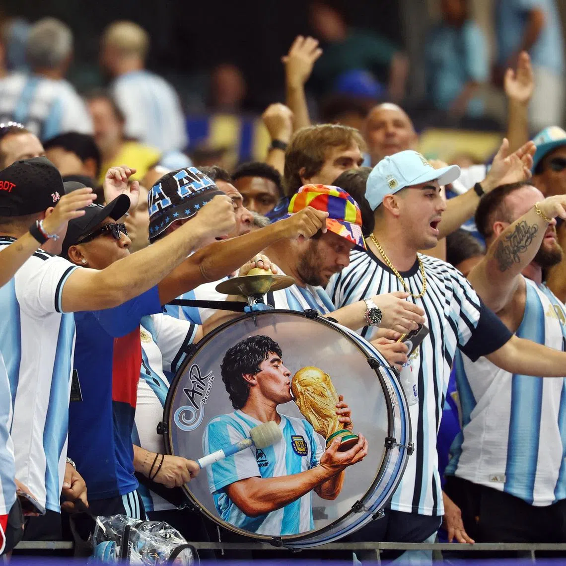 Soccer Football - FIFA World Cup 2026 - Group J - Argentina v Austria - Dallas Stadium, Arlington, Texas, U.S. - June 22, 2026 Argentina fans with a drum featuring a picture of Diego Maradona inside the stadium before the match REUTERS/Kai Pfaffenbach